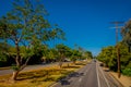 Los Angeles, California, USA, JUNE, 15, 2018: Palm trees street in Beverly Hills and cars circulating in the roads of Royalty Free Stock Photo