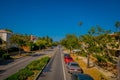 Los Angeles, California, USA, JUNE, 15, 2018: Palm trees street in Beverly Hills and cars circulating in the roads of Royalty Free Stock Photo