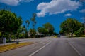 Los Angeles, California, USA, JUNE, 15, 2018: Palm trees street in Beverly Hills and cars circulating in the roads of Royalty Free Stock Photo