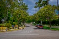 Los Angeles, California, USA, JUNE, 15, 2018: Palm trees street in Beverly Hills and cars circulating in the roads of Royalty Free Stock Photo