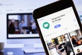 Los Angeles, California, USA - 24 March 2020: Hangouts Meet by Google app logo on phone screen close up with website on background