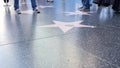 LOS ANGELES, CALIFORNIA, USA - 7 NOV 2019: Walk of fame promenade on Hollywood boulevard in LA. Pedastrians walking near celebrity Royalty Free Stock Photo