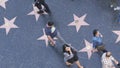 LOS ANGELES, CALIFORNIA, USA - 7 NOV 2019: Walk of fame promenade on Hollywood boulevard in LA. Pedastrians walking near celebrity Royalty Free Stock Photo