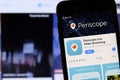 Los Angeles, California, USA - 27 November 2019: Periscope app icon on mobile phone screen with blurry website on laptop,