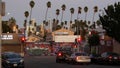 LOS ANGELES, CALIFORNIA, USA - 30 OCT 2019: Urban skyline and palms. LA city night aesthetic, graffiti painting on Vermont street Royalty Free Stock Photo