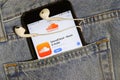 Los Angeles, California, USA - 10 October 2019:  Mobile phone with Soundcloud on App Store, logo on screen close up in blue jeans Royalty Free Stock Photo