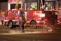 Los Angeles Fire Department fireman hoses off equipment