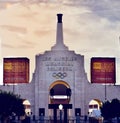Los Angeles Memorial Coliseum against a cloudy sky