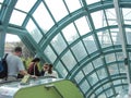 Los Angeles Park, Universal Studios Hollywood. People go down the escalator in the Studio. Spring 2015.