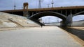 The Los Angeles river with person under the bridge