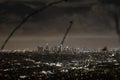 Los Angeles skyline - Night Time Panorama with view of tree branches Royalty Free Stock Photo