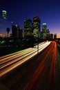 Los Angeles skyline with streaked freeway lights Royalty Free Stock Photo