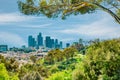 Los Angeles skyline is surrounded by trees from Elysian Park Royalty Free Stock Photo