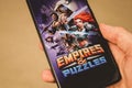 Los Angeles, USA - May 16, 2019: Empires and Puzzles mobile app on the display