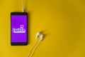 Twitch logo on smartphone screen on yellow background Royalty Free Stock Photo