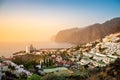 Los Gigantes resort town on Tenerife at sunset. Giant rock formations Acantilados de Los Gigantes as beautiful tourist