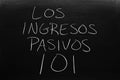 Los Ingresos Pasivos 101 On A Blackboard.  Translation: Passive Income 101 Royalty Free Stock Photo