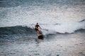 Paddleboarder riding a wave at Losari in Corsica