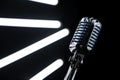 Close up of microphone in Music Studio with Black walls and lights Royalty Free Stock Photo