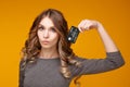 Lose-up portrait of happy young brunette woman holding credit card and colorful shopping bags, looking at camera Royalty Free Stock Photo