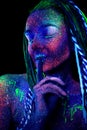 Cosmic woman, ultraviolet body art. Royalty Free Stock Photo