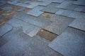 ÃÂ¡lose up view of bitumen shingles roof damage that needs repair Royalty Free Stock Photo