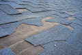 ÃÂ¡lose up view of bitumen shingles roof damage that needs repair. Royalty Free Stock Photo