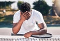 Loser, tennis and black man fitness, for game and losing with headache outdoor on court. Mental health, African American Royalty Free Stock Photo