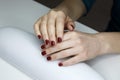 ÃÂ¡loseup of hands of a young woman with long red manicure on nails Royalty Free Stock Photo