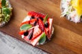 ÃÂ¡loseup macro set of different northern trendy appetizers on smorrebrod rye bread with red caviar and avocado, strawberries,