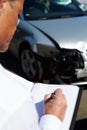 Loss Adjuster Inspecting Car Involved In Accident Royalty Free Stock Photo