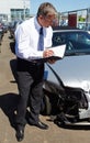 Loss Adjuster Inspecting Car Involved In Accident Royalty Free Stock Photo