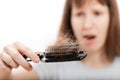 Loss hair comb in women hand Royalty Free Stock Photo