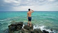 Lost alone male teen standing on sea