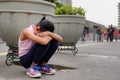 Lost Asian Little Girl Sitting Sad and Lonely On The City Pedestrian Seems Lost or Crying