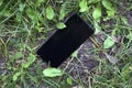 Lost black smartphone smart phone cellphone cell grass meadow summer