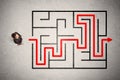 Lost businessman found the way in maze with red arrow Royalty Free Stock Photo