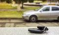 Lost car keys on the fallen needles of blue spruce. back blur background bokeh Royalty Free Stock Photo