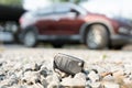 Lost car keys on the ground, Car keys dropped on the floor or fall lying on the street home front. Walking Away From Lost Car Key Royalty Free Stock Photo