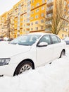 Lost car under huge snow and yellow orange resident house Royalty Free Stock Photo