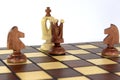 On the chessboard, the queen and two horses announced a check and mat to the white king Royalty Free Stock Photo