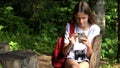 Lost Child with Binoculars in Mountains Trails Playing Smartphone, Kid Hiking at Camping, Teenager Girl in Adventure Trip Vacation Royalty Free Stock Photo