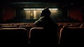 Lost in the Cinema: A Mysterious Figure Absorbed by the Screen.