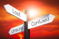 Lost, confused, unsure concept - signpost with three arrows Royalty Free Stock Photo