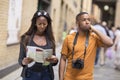 Young couple on holiday with a map