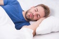 Lost in a deep sleep. Late sleeper enjoying sleep in the morning. Handsome man having sleep in bed. Dont wake him in the Royalty Free Stock Photo