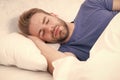 Lost in a deep sleep. Late sleeper enjoying sleep in the morning. Handsome man having sleep in bed. Dont wake him in the Royalty Free Stock Photo