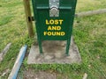 Lost and found sign on green metal box Royalty Free Stock Photo