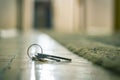 Lost keys in the hotel lobby from the office, the background and background are blurred with the bokeh effect Royalty Free Stock Photo