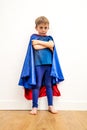 Lost little superhero child with arms folded thinking about sadness Royalty Free Stock Photo